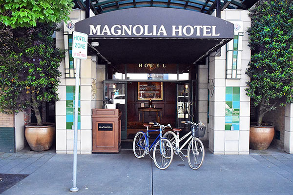 Bikes outside street level entrance of Magnolia Hotel