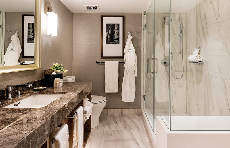 The new bathrooms in the Magnolia Hotel in Victoria, BC feature deep soaking tubs and oversize showers.