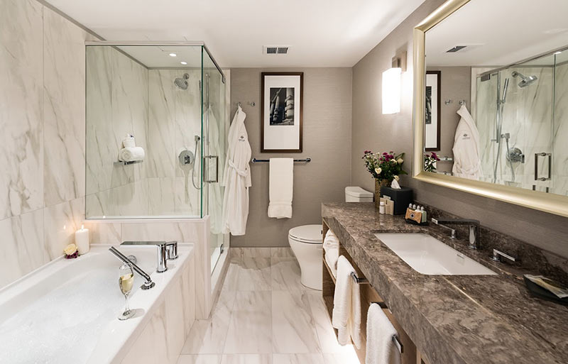 The new bathrooms in the Magnolia Hotel in Victoria, BC feature deep soaking tubs and oversize showers.